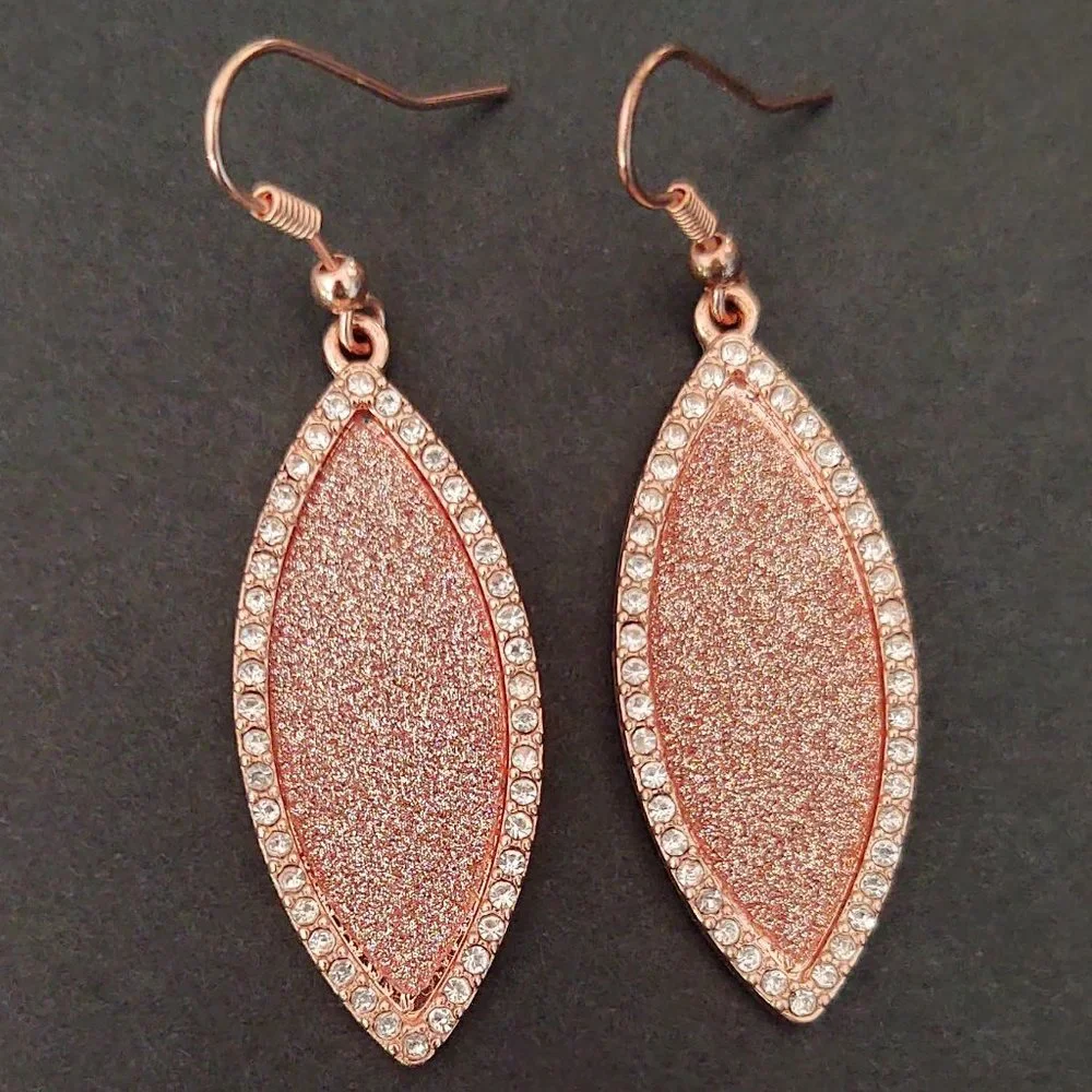 Sparkly rose gold dangle earrings with cz accents
